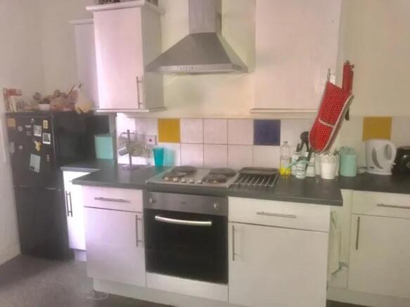 A functional and tidy kitchenette with modern a...