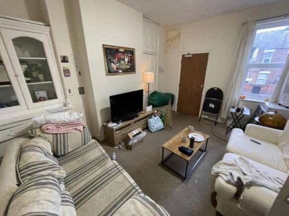 A cozy living room with comfortable seating and...