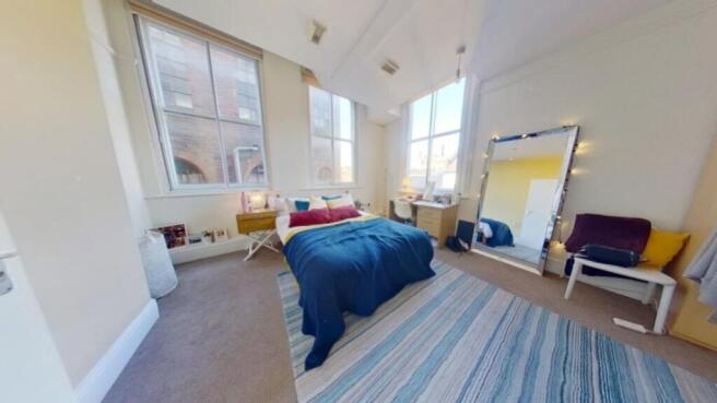 A spacious and inviting large double bedroom wi...
