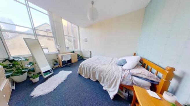 A spacious and bright large double bedroom with...