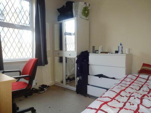 A cozy and inviting double bedroom with ample s...