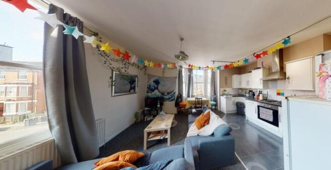 A bright and inviting living room featuring a s...