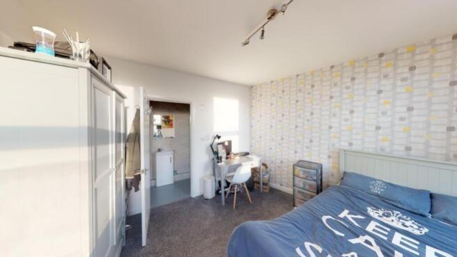 A spacious and well-lit large double bedroom, p...