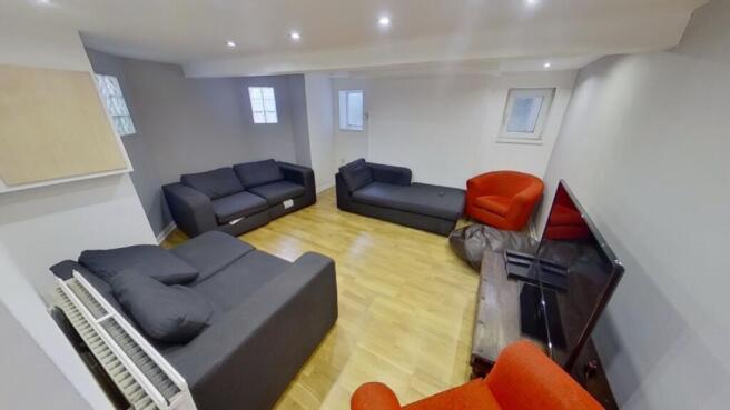 A spacious and inviting modern living room, per...