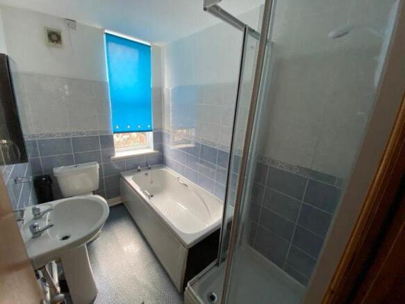 A spacious and clean bathroom featuring both a ...