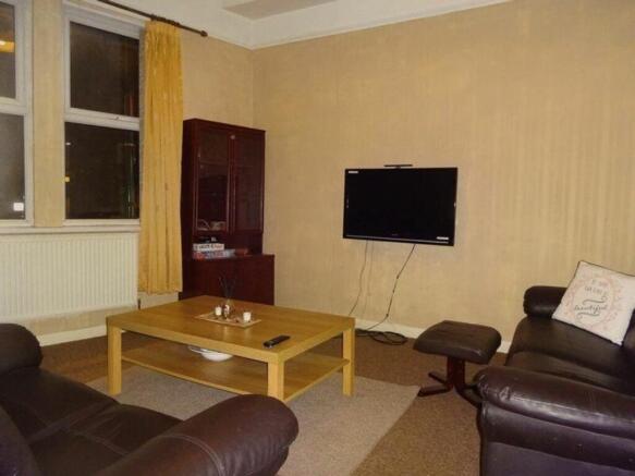 A spacious and inviting large modern living roo...