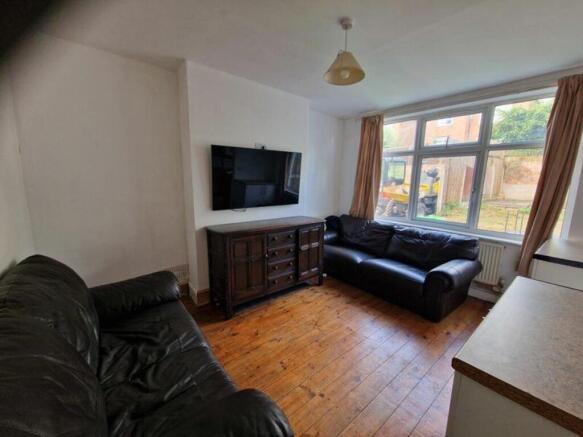 A spacious and inviting large modern living roo...