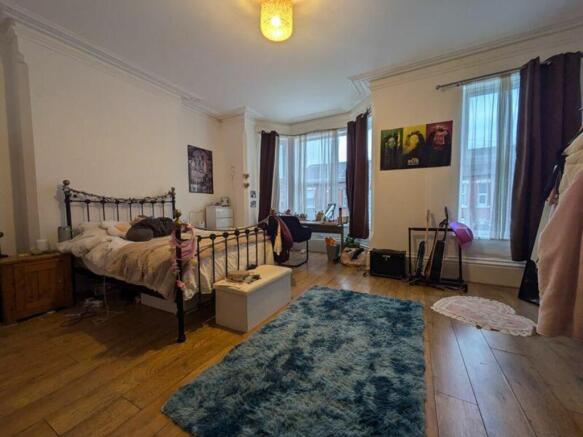 A spacious and inviting large double bedroom fi...