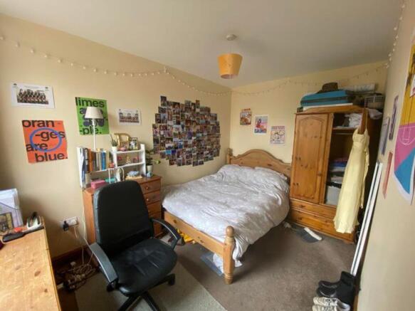 A cozy and inviting double bedroom with persona...