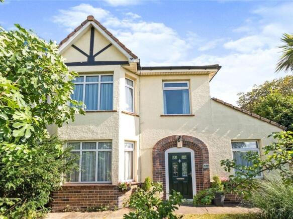 A charming front view of the property featuring...