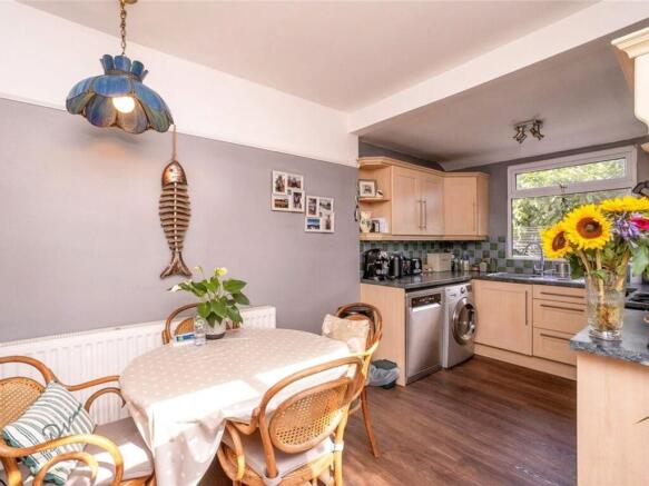 Bright and inviting kitchen featuring modern ap...