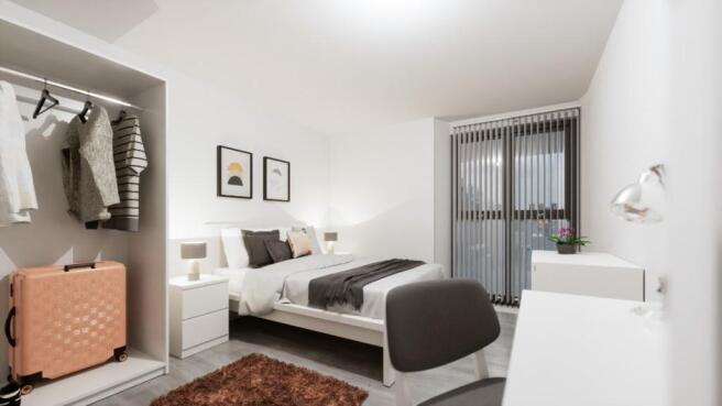 A bright and spacious double bedroom featuring ...