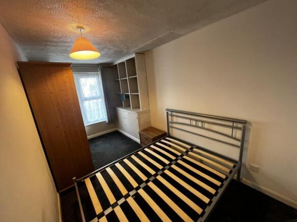 Inviting double bedroom featuring ample natural...