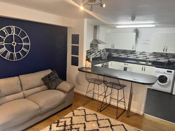 A modern living room featuring a stylish sofa a...