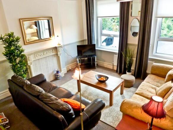 A spacious and inviting large modern living roo...