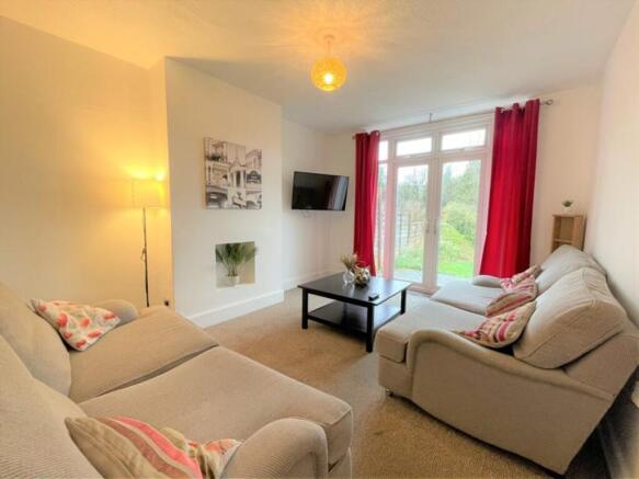 Bright and inviting living room featuring comfo...