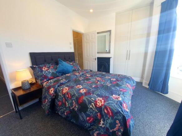 Bright and inviting double bedroom featuring a ...