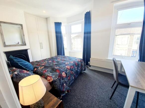 Bright and inviting double bedroom featuring a ...