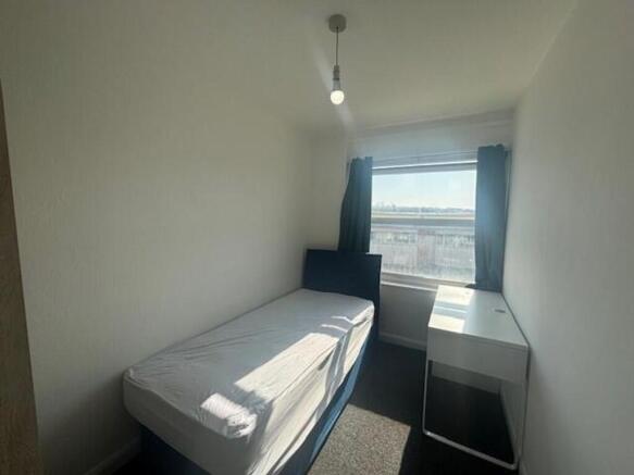 Bright and tidy single bedroom featuring a larg...