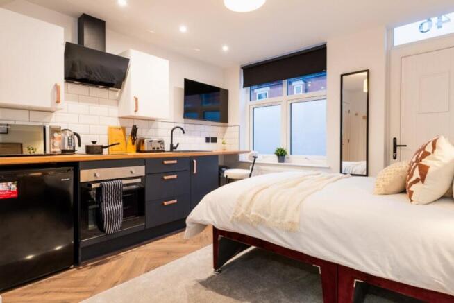 A beautifully designed double bedroom featuring...