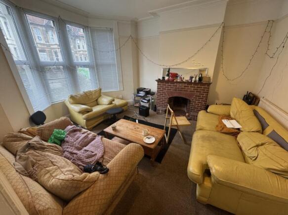 Spacious living room featuring comfortable seat...