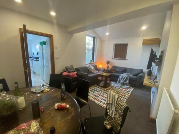 A spacious and inviting modern living room, per...