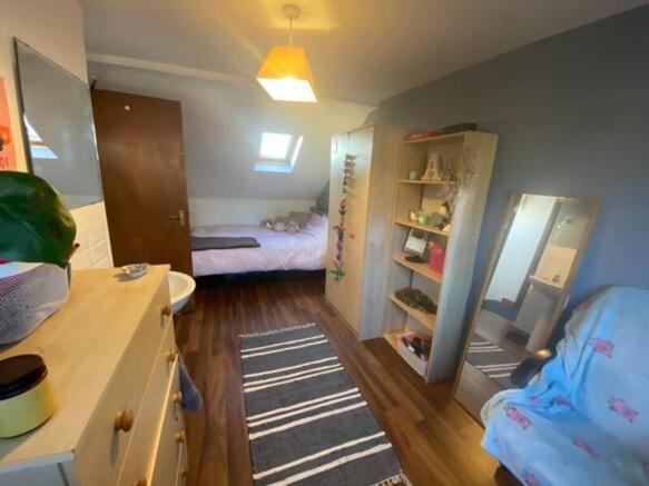 A cozy and well-decorated double bedroom, perfe...