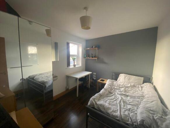 A cozy double bedroom featuring a comfortable b...