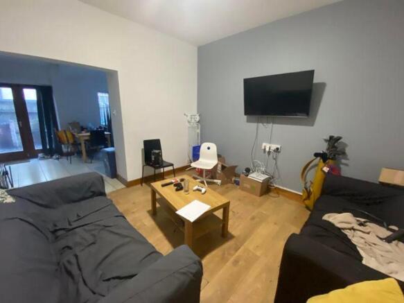 A spacious and inviting modern living room, per...