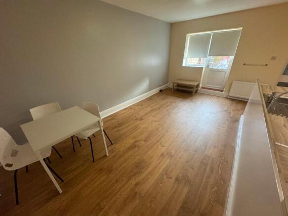 Bright and spacious living room featuring a coz...