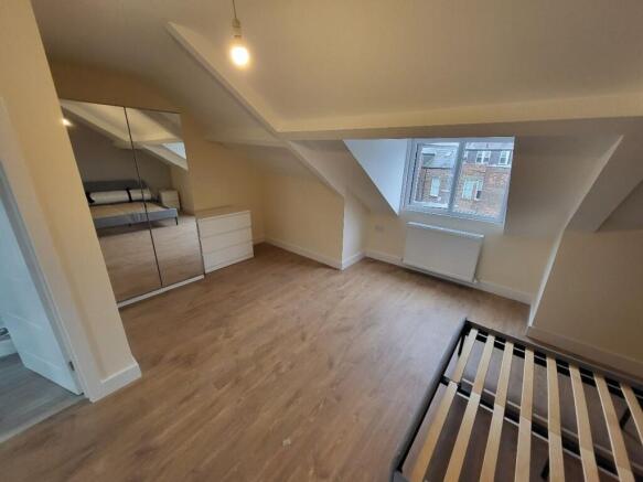 Bright and spacious double bedroom featuring am...