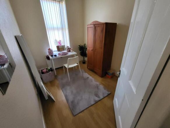 This charming double bedroom features a cozy la...
