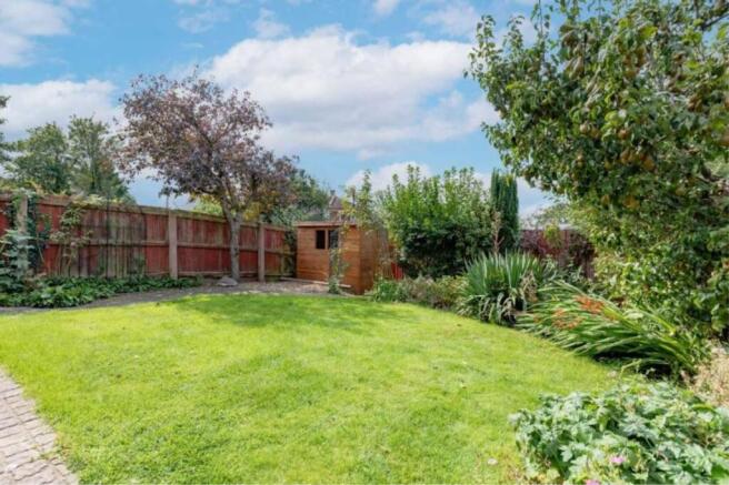 A beautifully maintained garden featuring lush ...