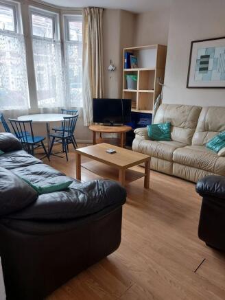 A cozy living room featuring comfortable leathe...