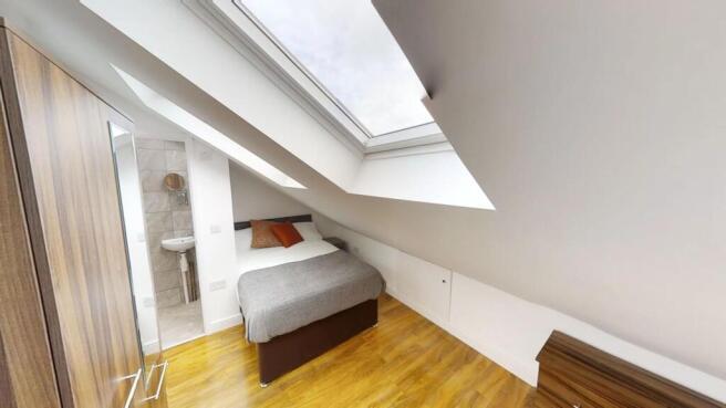Bright and inviting double bedroom featuring a ...
