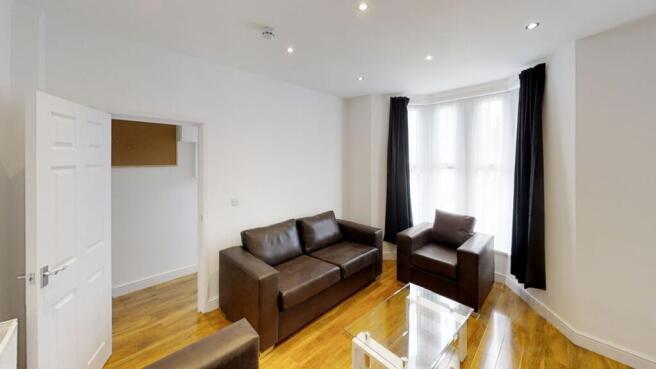 Bright and inviting living room featuring styli...
