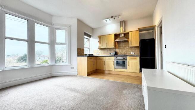 Bright and spacious kitchen area featuring mode...
