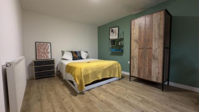 A stylish and inviting double bedroom featuring...