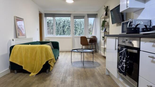 A bright and inviting living room with modern d...
