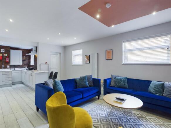 A spacious and inviting modern living room feat...