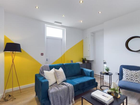 A bright and inviting large modern living room ...