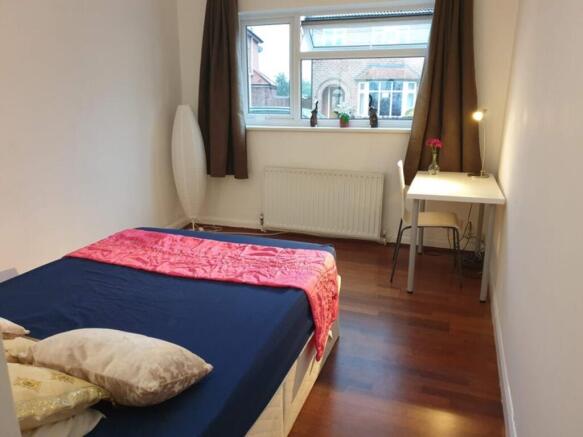 Bright and inviting double bedroom featuring a ...
