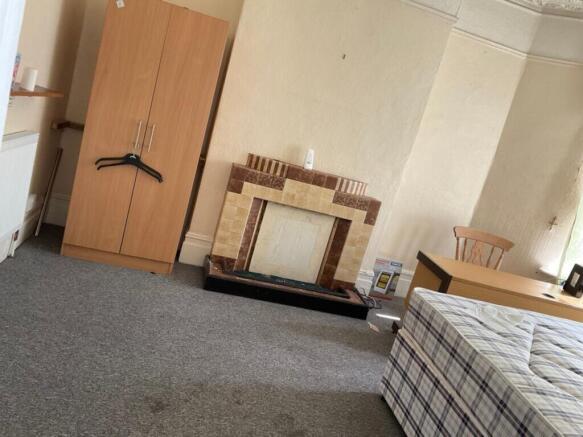 This spacious double bedroom features ample flo...