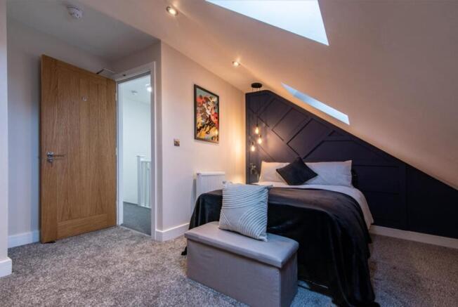 Experience a stylish double bedroom featuring m...