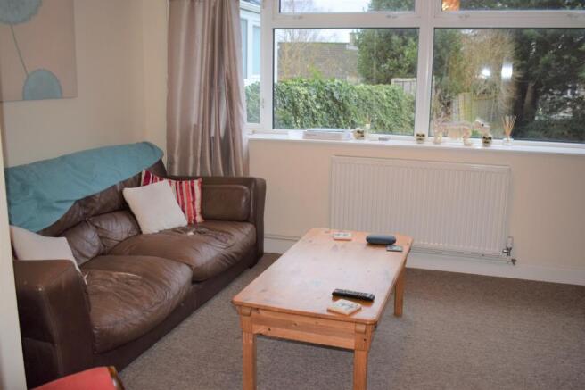A cozy living room featuring a comfortable leat...
