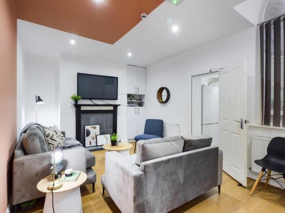 A spacious and stylish living room with modern ...