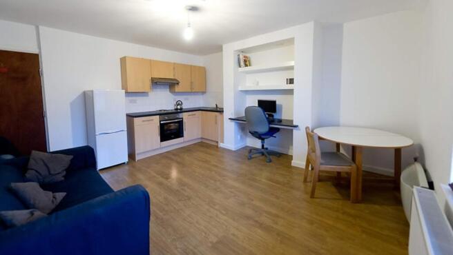 Spacious and well-lit kitchen area featuring mo...