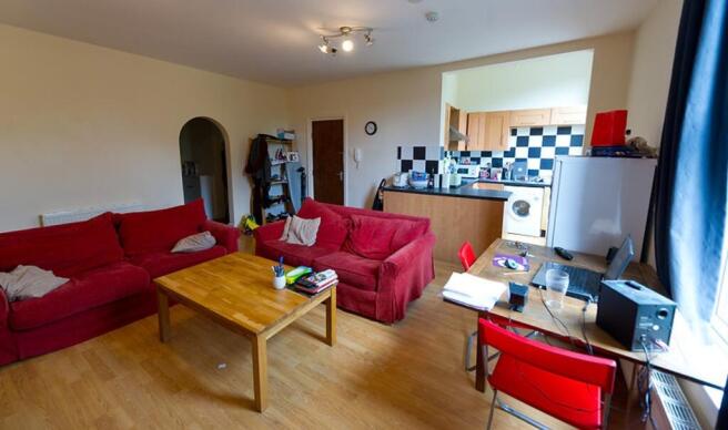 A spacious and inviting living room featuring c...