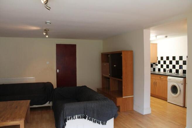 Spacious living room featuring modern furniture...