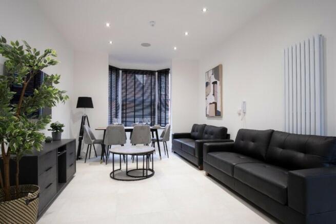A stylish and modern living room featuring slee...